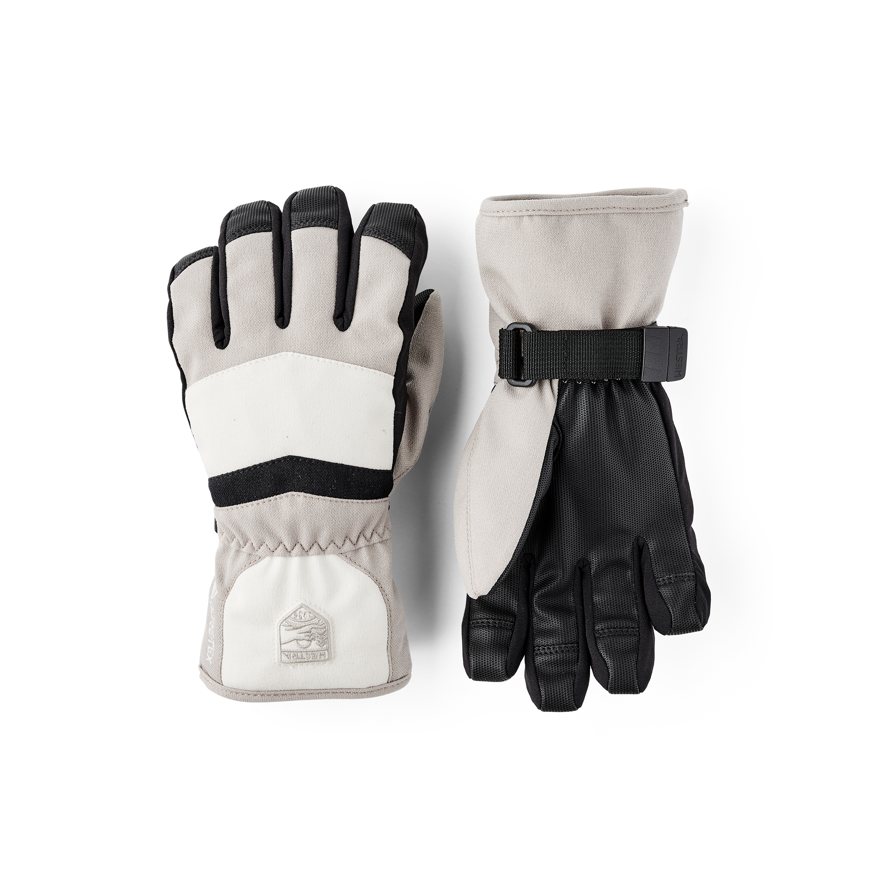 Beige and white fabric children’s glove with black synthetic palm and wrist adjustment